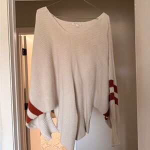 Cozy Cream Knit Sweater with Rust Stripe Sleeves